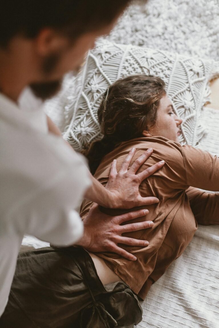 Close-up of a couple enjoying a massage session indoors, highlighting relaxation and therapy.